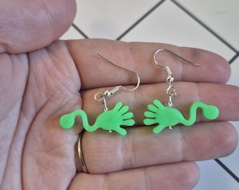 Green slappy hand beaded dangle earrings, glow in the dark statement jewelry, kidcore inspired fashion accessory, 90s nostalgic gift ideas