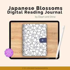Könnte beinhalten: Ein digitales Lesetagebuch mit einem weißen Blumenmuster auf marineblauem Hintergrund. Das Tagebuch liegt auf einer Holzoberfläche, mit einem weißen Stift und dem Text "Japanese Blossoms Digital Reading Journal" sichtbar.