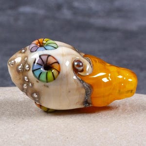 Handmade glass shell bead in yellow and ivory lampwork glass