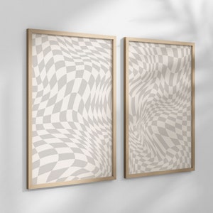 Puede incluir: Dos impresiones enmarcadas con un patrón a cuadros en tonos de gris y blanco. El patrón está distorsionado para crear un efecto ondulado y abstracto.