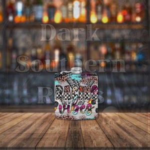 May include: A black and white checkered flask with a leopard print and blue and white paint splatter design. The flask has the text "Racing Vibes" in pink, yellow, and black letters.