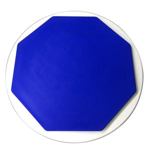 May include: A blue octagonal drum pad with a white rim, perfect for practicing drumming.