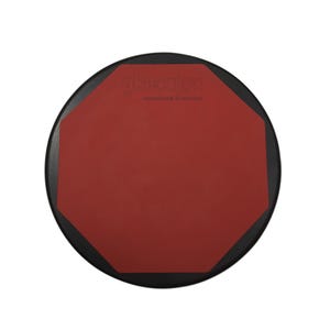 May include: A red and black practice pad for drummers. The pad is octagonal and has the text "akcajon Handmade in Istanbul" printed on it.