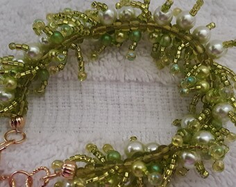 Bracelet- Pearls in a field of green- ladies beaded Cha cha bracelet- fully adjustable