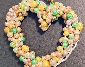 Ornament - orange, green, white and  gold.