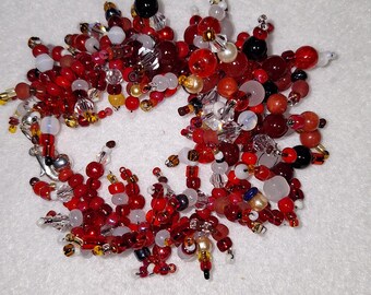 Cha-Cha Bracelet – shades of red and white, glass beads, 6 inch and adjustable.