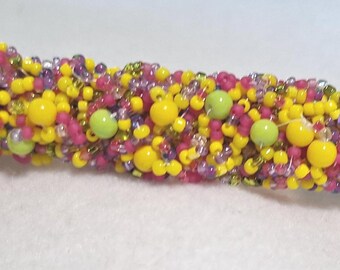 Barrette-Confetti, colorful yellow, pink and green glass beads. Measures 4 inches.