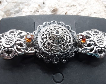 Barrette, 3 inches, mixed metals, gunmetal and silver with yellow/orange glass rhinestones.
