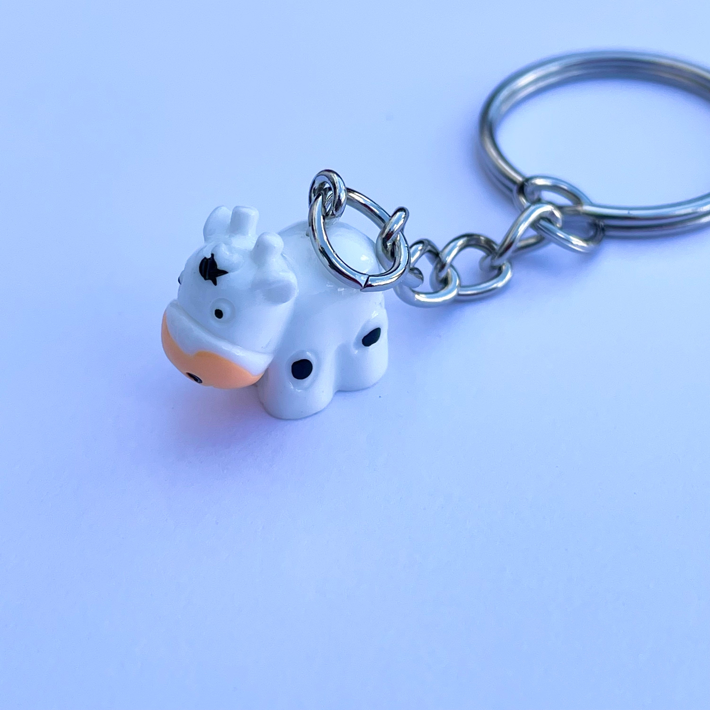 Pooping cow deals keychain