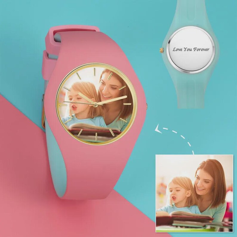 May include: Pink and light blue wristwatch with a gold-colored watch face. The watch face features a photo of a woman and a young girl. A second light blue watch is also shown, with the text "Love You Forever" on the face.