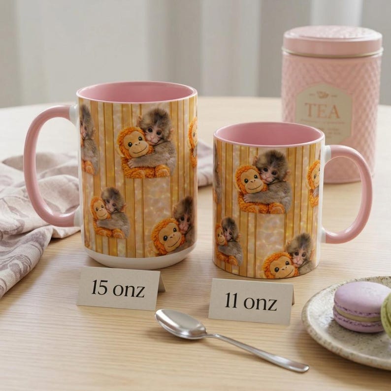 May include: A white ceramic mug with a black handle and the text "But First, Coffee" in a bold, black font. The mug is set against a blurred background, suggesting a cozy setting.