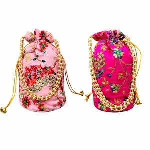 May include: Two embroidered drawstring bags. One is light pink with red and green floral designs, the other is hot pink with blue and green floral designs. Both bags have a beaded trim and gold drawstrings.