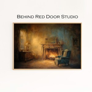 May include: A framed print depicting a cosy interior with a fireplace, armchair, and side table. The artwork features a warm colour palette, with the text "BEHIND Red Door STUDIO" at the top.