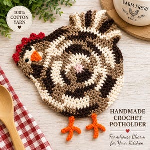 May include: A handmade crochet potholder in the shape of a chicken. The potholder features a spiral design in shades of brown, beige, and white, with a red comb, orange beak, and orange feet. The text "100% Cotton Yarn" is in a circle.