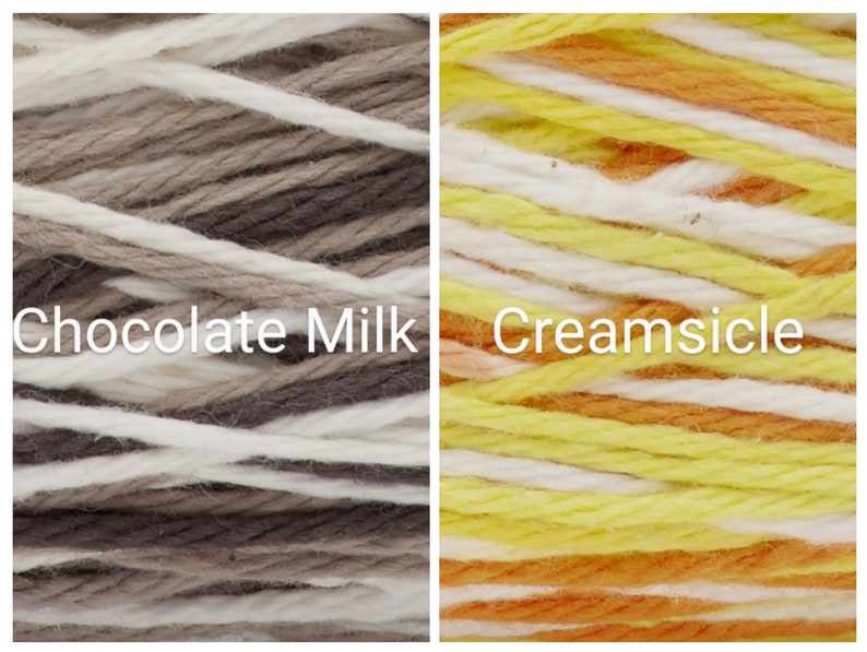 Puede incluir: Dos madejas de hilo, una etiquetada como "Chocolate Milk" con hebras blancas, marrones y beige, y la otra como "Creamsicle" con hebras amarillas, naranjas y blancas. El hilo est&aacute; bien enrollado, mostrando la textura y las variaciones de color.
