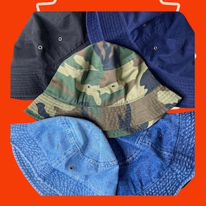 100% Washed Cotton Canvas Bucket Boonie Hat in Denim, Army, Black or Navy for Summer Festival Fun. Army buckets are mixed with polyester*