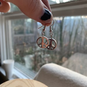 Silver plated hippie peace sign dangly earrings