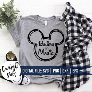 May include: A gray t-shirt with a black outline of Mickey Mouse's head and the text "Believe in Magic".