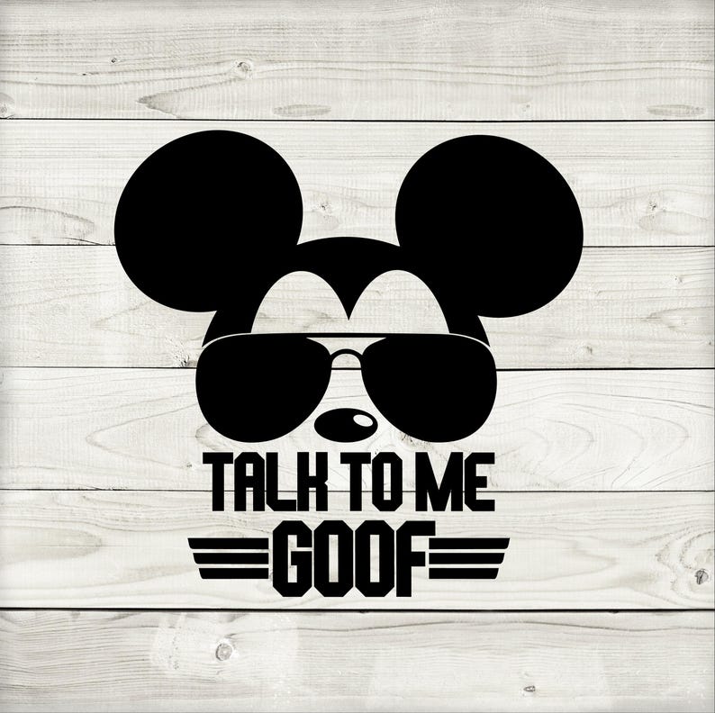 May include: Black silhouette of Mickey Mouse wearing sunglasses, with the text "TALK TO ME GOOF" and horizontal lines below. The design is set against a white wooden plank background.