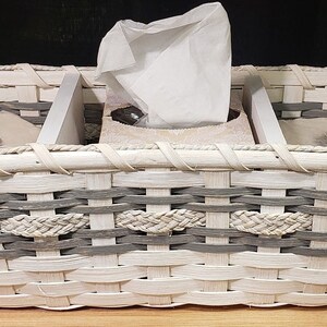 May include: White wicker basket with gray accents, divided into three sections. The center section holds a box of tissues, and the two side sections are empty.