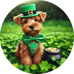 May include: A brown and tan dog wearing a green leprechaun hat and a green bow tie. The dog is sitting in a field of green clover with a pot of gold behind it.