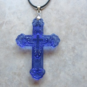 Crystal Cross On Black Cord. Beautiful Blue Carved Crystal Cross. The Cross Is Quite Large And Chunky. Religious--Spiritual Necklace!