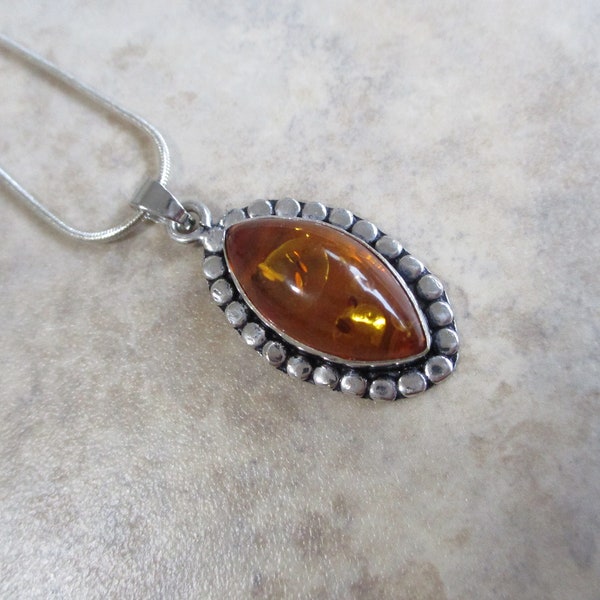 Baltic Amber Pendant On A  20" Snake Chain!  It is Smaller But Has Big Glow--For the Lady That Prefers Smaller Pendant's. Awesome Amber!