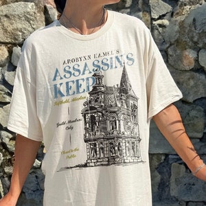 Assassin's Keep Shirt | Throne Of Glass Merch Aelin Galathynius Terrasen Licensed SJM Universe Merch ACOTAR Crescent City Manon Blackbeak