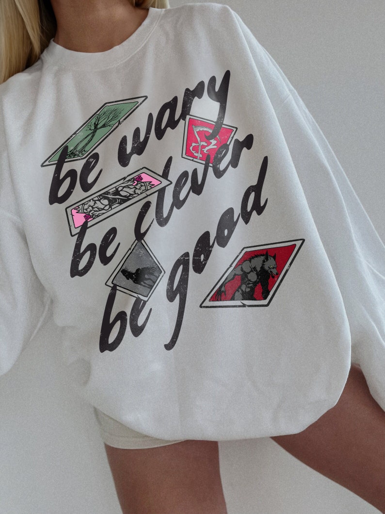 One Dark Window Sweatshirt | Be Wary Be Clever Be Good Licensed Shepherd King by Rachel Gillig Merch Elspeth Spindle Rayvn Yew Blunder Merch White
