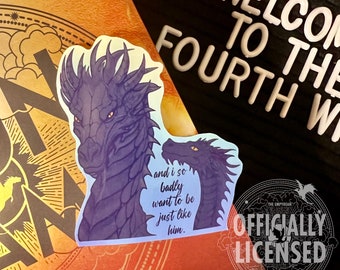 May include: A sticker featuring a purple dragon with the text "and i so badly want to be just like him." The sticker is on a book cover with the text "Welcome to the Fourth World" and "Officially Licensed" in a circle.