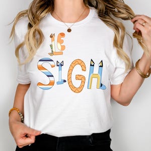 Koszulka Le sigh Blue Heeler Mom Koszulka Francja Paris lover Fraza francuska Blue Mom Moje emocje w ciągu dnia Muffin Fan Koszulka Blue Era Unisex