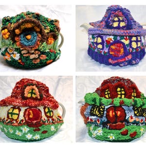 May include: Four handmade tea cozies, each crafted with colorful yarn in a whimsical house design. The cozies feature intricate details like windows, doors, and floral accents, with a variety of colors including green, red, purple, and white.
