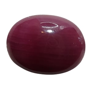 May include: A polished, oval gemstone in a rich burgundy hue. The cabochon cut gives it a smooth, rounded appearance. The surface reflects light, showing its glossy texture. This opaque gemstone is ideal for jewellery.