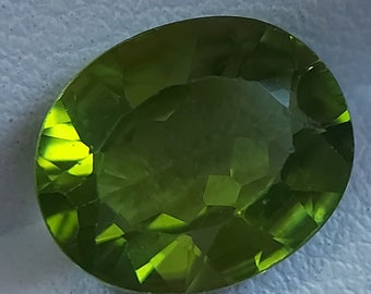 Bright neon Peridot gemstone - faceted natural Chrysolite 4.25 CTS - oval 12 x 10 mm - loose transparent Olivine stone for jewelry making