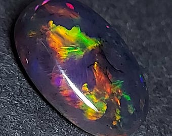 Mystical black opal cabochon - natural welo opal gemstone 10.80 CTS - oval 20 x 15 mm - loose Ethiopian rainbow stone for jewelry making