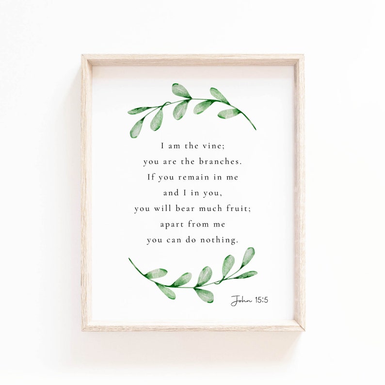 May include: A framed print featuring a watercolour illustration of green leaves and a quote from the Bible, John 15:5, which reads: "I am the vine; you are the branches. If you remain in me and I in you, you will bear much fruit; apart from me you can do nothing."