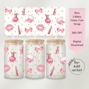 May include: Three clear glass can wraps with wooden lids, decorated with pink lipstick, perfume bottles, bows, and makeup compacts. The background has a repeating pattern of the same elements and gold polka dots. A pink banner reads "16oz Libbey Glass Can Wrap".