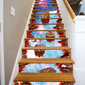 Puede incluir: Un conjunto de peldaños de escalera impresos en 3D con una escena de océano azul y naranja. Los peldaños están diseñados para parecer que se camina sobre el agua.