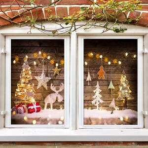 May include: A window with a wooden frame and a view of a Christmas scene. The scene includes a small Christmas tree with lights, a gingerbread man, and other decorations. The window is decorated with a garland of lights.
