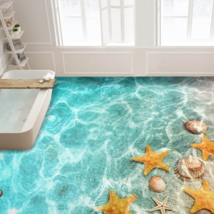May include: A bathroom floor with a blue and white ocean-themed design. The floor features starfish and seashells, creating a beach-like atmosphere.
