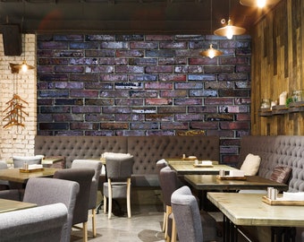 May include: A modern restaurant interior with a brick wall accent, grey upholstered booths, and wooden tables with chairs.