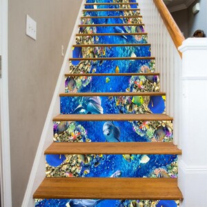 May include: A set of 8 stair treads featuring a colorful underwater scene with dolphins, coral reefs, and tropical fish. The treads are made of durable vinyl and are easy to apply.