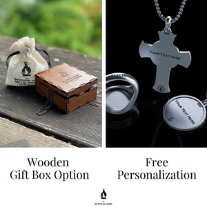 May include: A silver cross pendant necklace with a wooden gift box. The cross has the text "YOUR TEXT HERE" engraved on it. The necklace is available with free personalization.