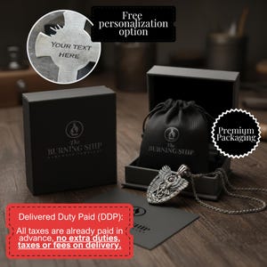 a pendant necklace with a black leather pouch, a black box, and a black bag, all placed on a wooden surface.