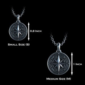 May include: Silver compass pendant necklace, available in small (0.8 inches) and medium (1 inch) sizes. The pendant features a detailed compass rose design, suspended from a delicate chain. The text "SMALL SIZE (S)" and "MEDIUM SIZE (M)" are visible.