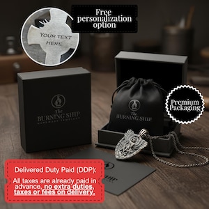 a pendant necklace with a black leather pouch, a black box, and a black bag, all placed on a wooden surface.