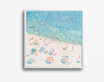 May include: An aerial view of a beach scene with people relaxing under colorful umbrellas. The water is a light blue and the sand is white. The umbrellas are a mix of pink, blue, and white.