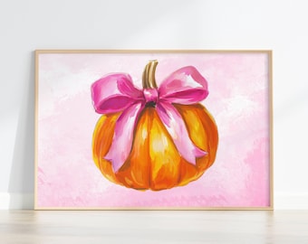 Puede incluir: Pintura de acuarela enmarcada de una calabaza con un lazo rosa. La calabaza es naranja y amarilla, con un tallo marrón. El lazo es de color rosa brillante. El fondo es un lavado rosa claro.