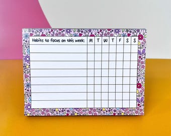 Habit Tracker Pad - A6 Notizblock zum Nachverfolgen wöchentlicher Gewohnheiten, Ziele erreichen, lila Blumen Planner Pad, Notizblock für Selbstpflege