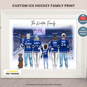 May include: A framed custom ice hockey family print featuring a family of six in blue hockey jerseys with names and numbers. The print includes the text "The Winter Family" and "CUSTOM ICE HOCKEY FAMILY PRINT". A brown dog is also included in the illustration.